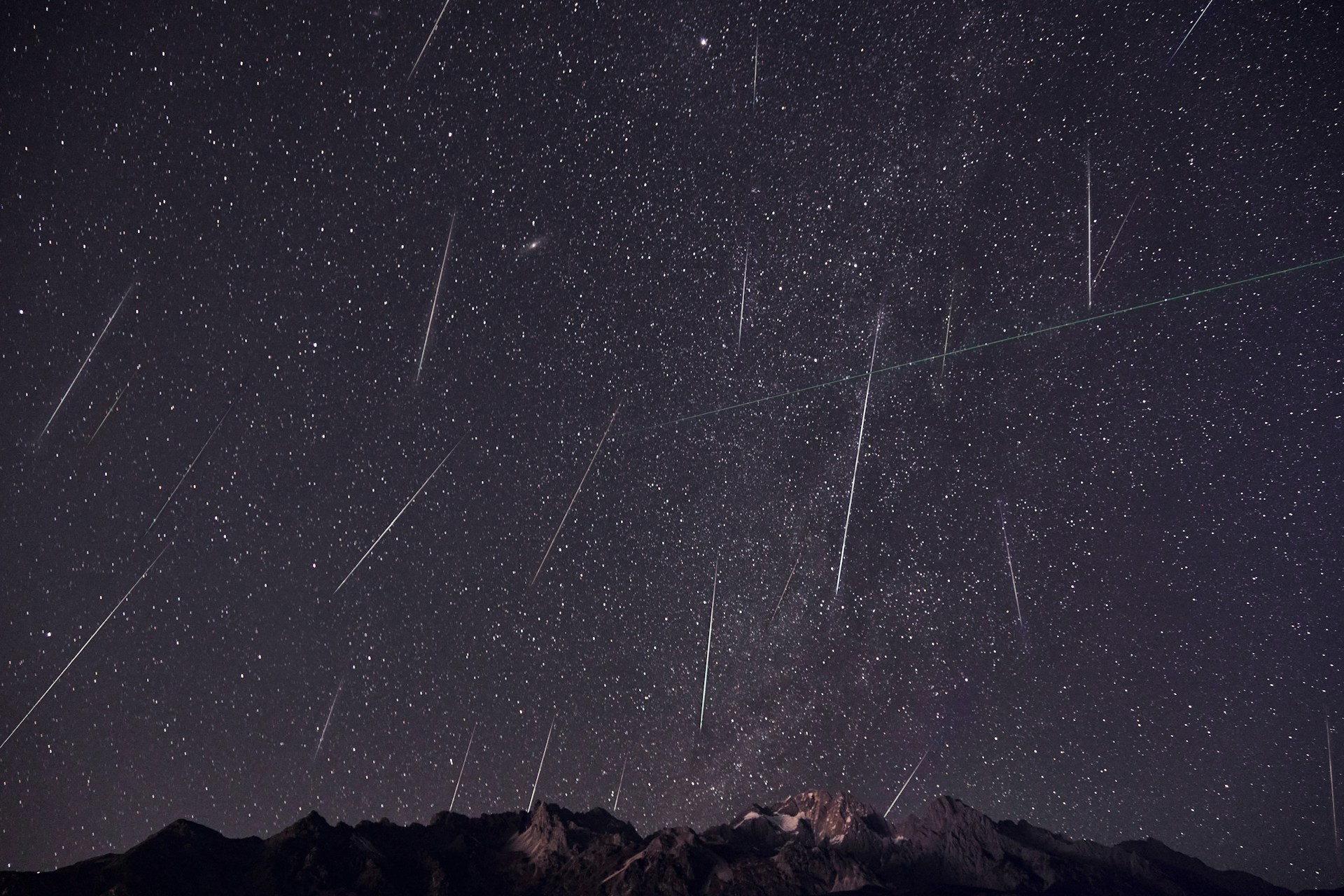 meteor shower over mountains