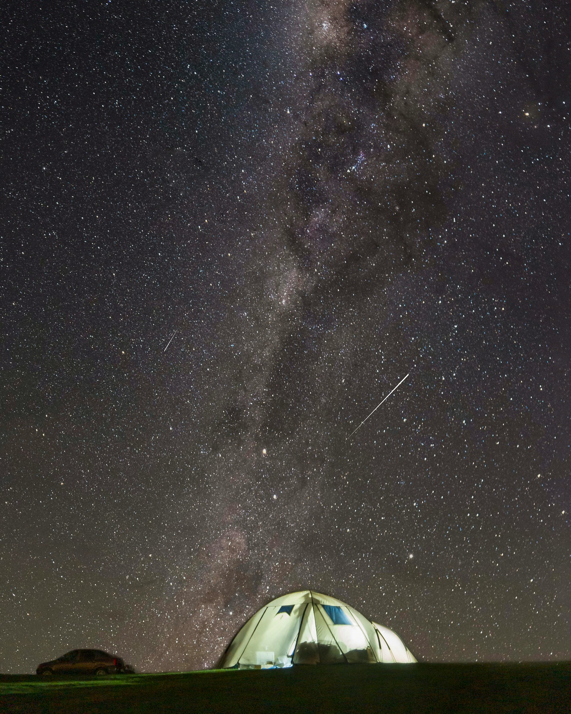 meteor shower and milky way over tent