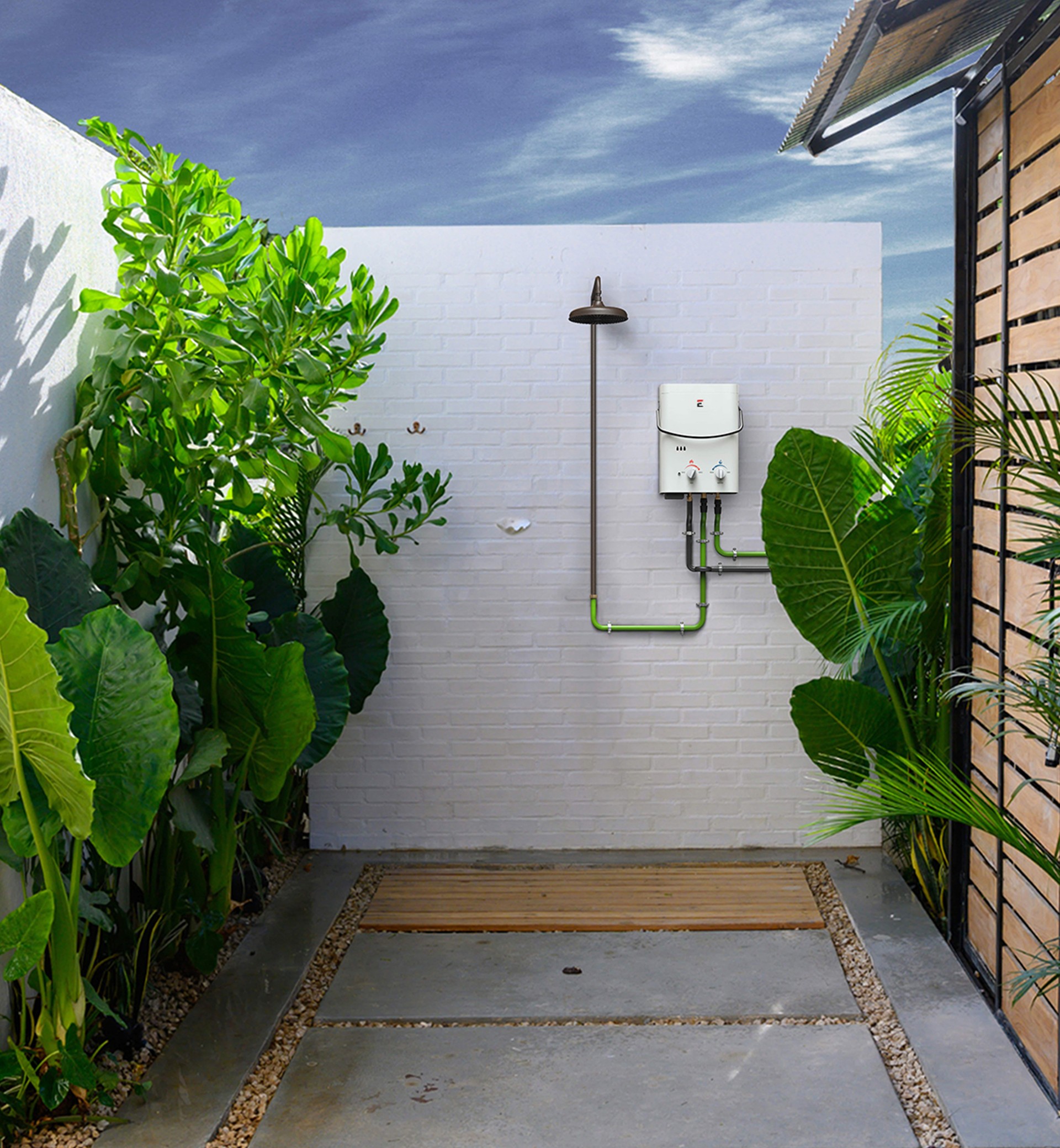 Eccotemp L5 portable tankless water heater plumbed to a wall-mounted outdoor shower head