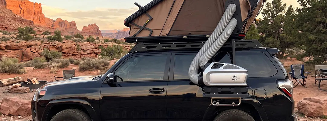 Mark 3 ducted into a rooftop tent ZERO BREEZE Mark 3 on a rear rack with ducts running up into a rooftop tent at a desert camp
